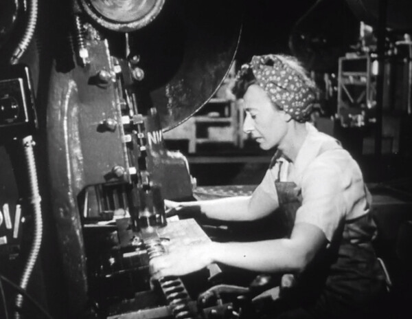 Woman Working a Press Machine