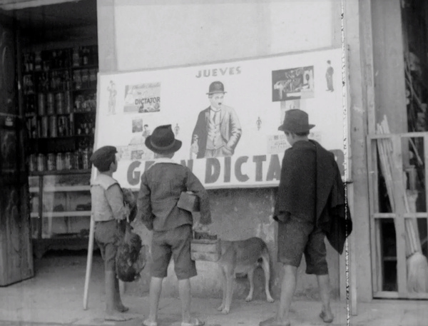 Children Looking at Poster for The Great Dictator