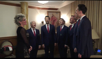Photo  one of the King's singers performing "Love Her" by the Beatles to Sylvia McNair in her dressing room
