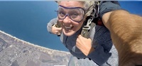 Photo of Sylvia McNair skydiving over Monterey, California 2019