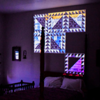 A pattern dedicated to Sarah Parke Morrison, the first white, female student of Indiana University, was projected on the south wall of the guest room.